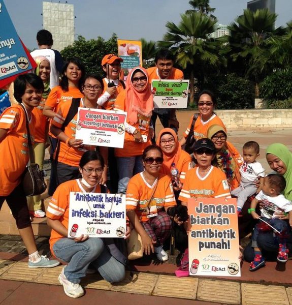 Participants with message boards in a walk to raise awareness about smart use of antibiotics in Jakarta, Indonesia.