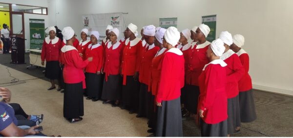 The women from the church singing at the WAAW launch event.